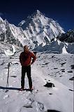Mike Farris on the way to the base of Broad Peak. K2 in the background